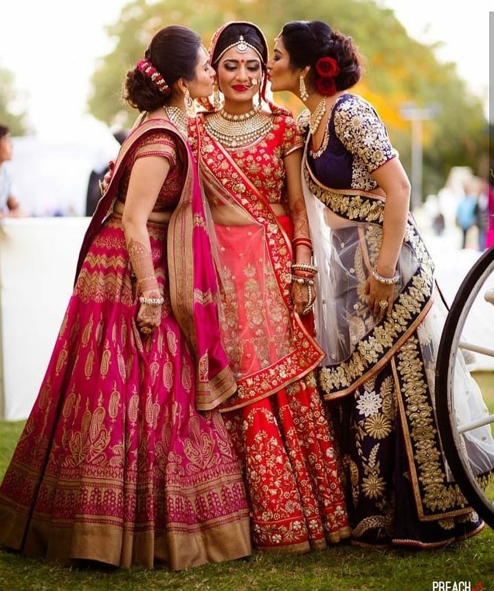 24. These sisters are careful not to leave lipstick stains on the bride!