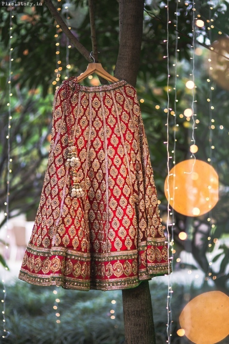 2. Hanging the lehenga with the wedding decor: 