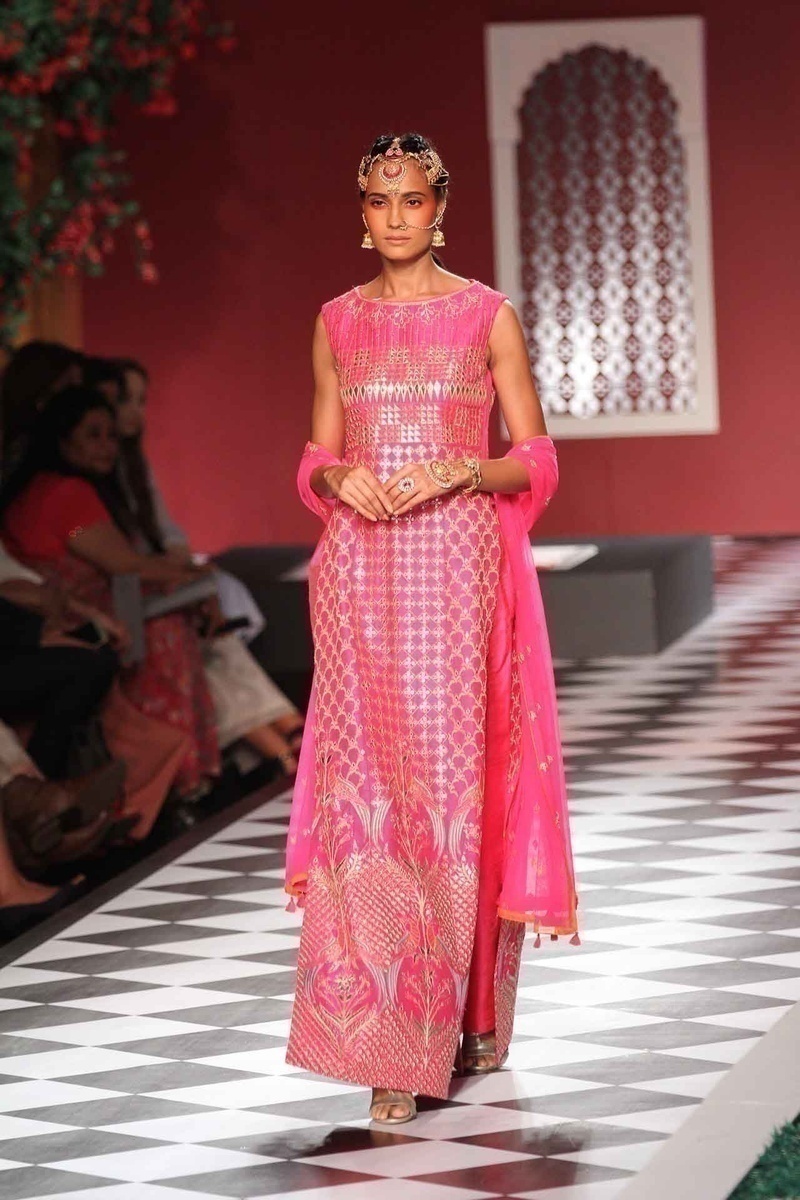 Anita Dongre does pink right! Pairing the classic bridal saree and lehenga with jackets and capes - Geometrical figures and nature inspired patterns dominated the pink section!