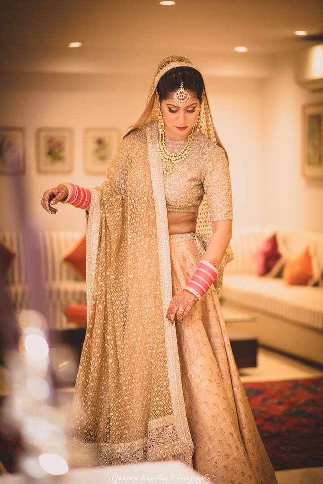 red bridal lehenga with golden dupatta