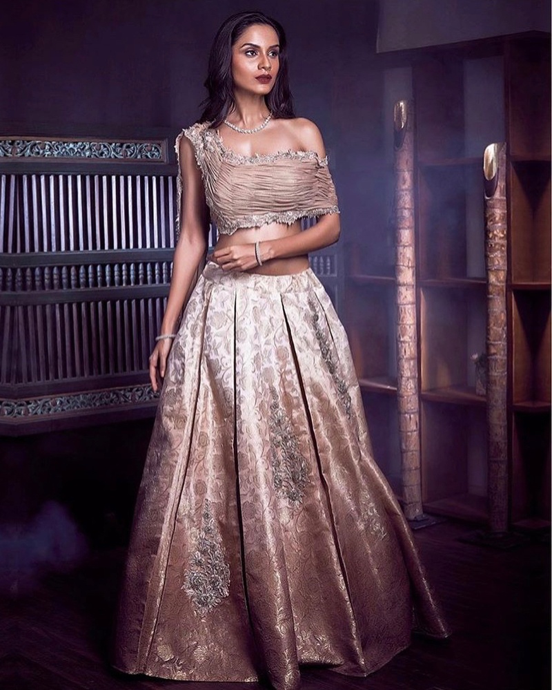 DEEP WINE BRIDAL LEHENGA SET WITH ALL OVER GOLD AND ROSE GOLD EMBROIDERY  PAIRED WITH A MATCHING HAND EMBROIDERED DUPATTA AND CUMMERBUND. - Seasons  India