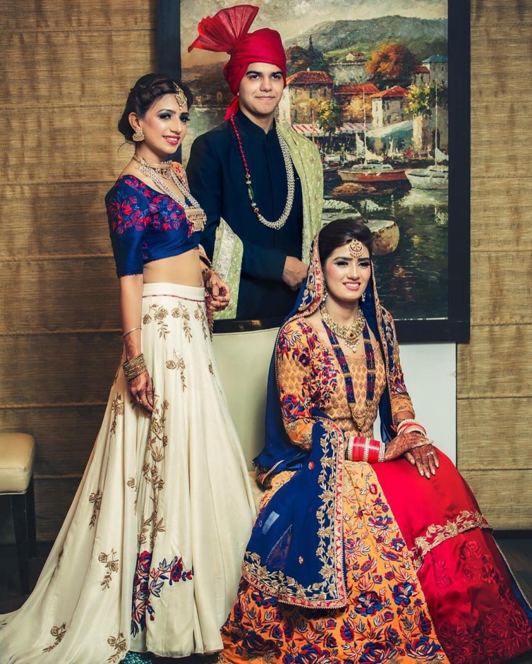 9. The sisters can’t stop staring at this beautiful bride!