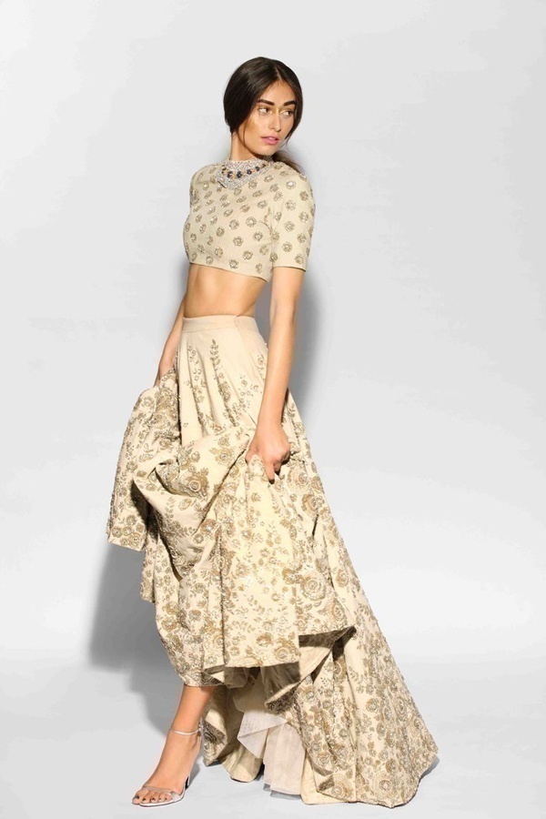 Super stylish off-white bridal wedding lehenga with bare mid-riff